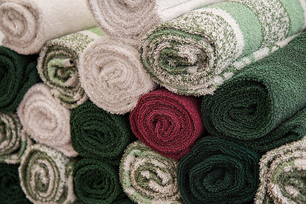 Rolled bath towels in a pile