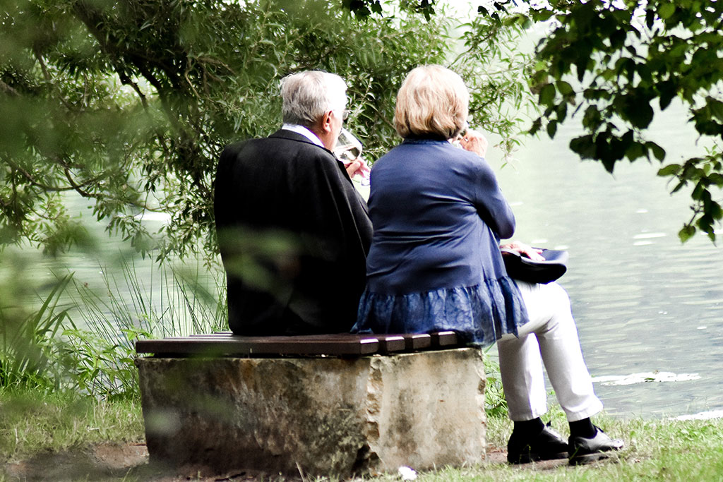 Older couple sitting outside together