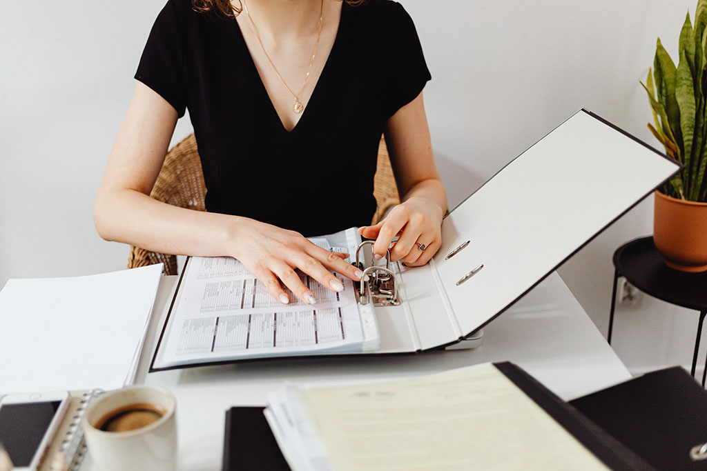 Woman putting away documents