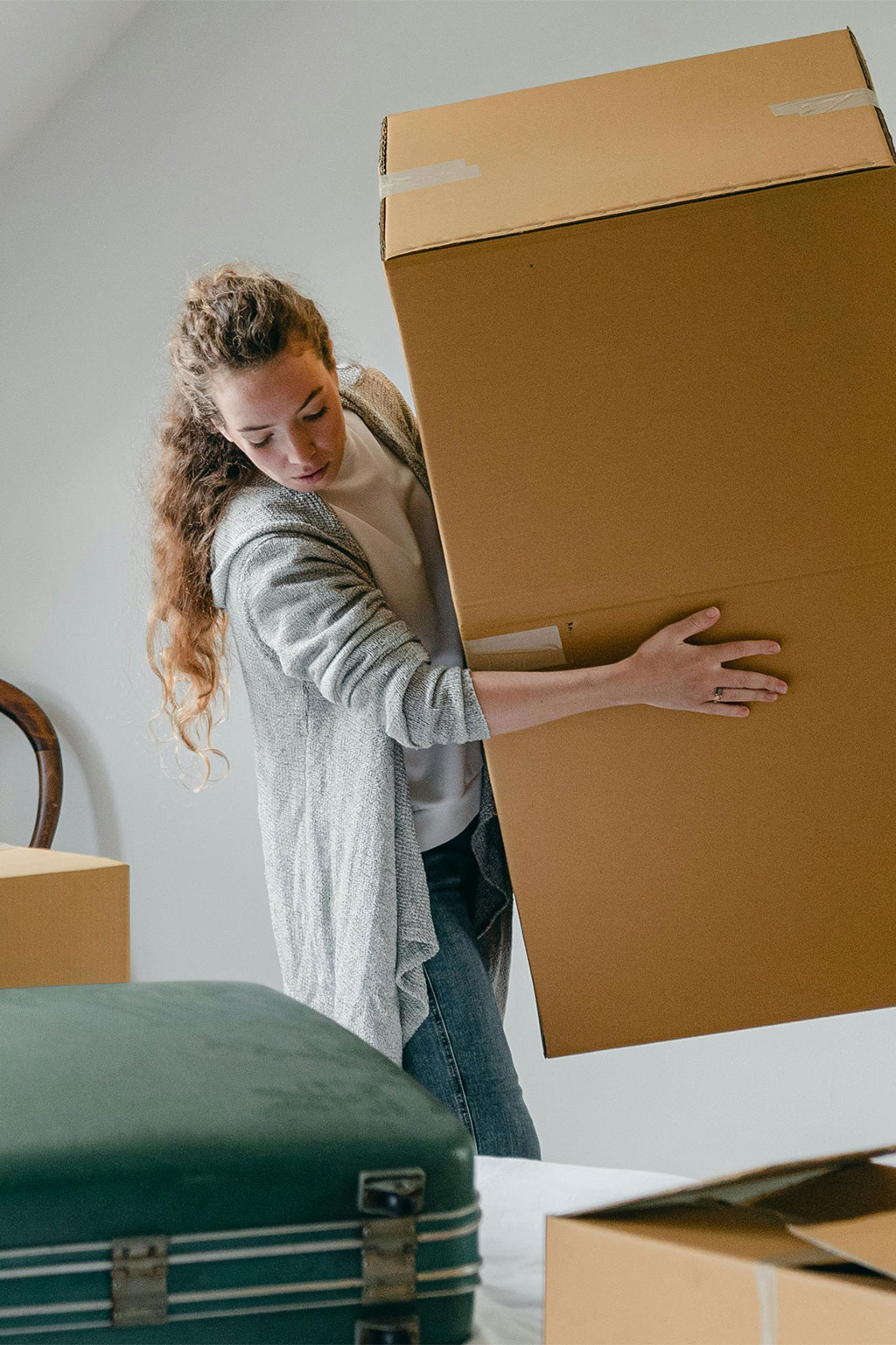 Woman moving moving boxes