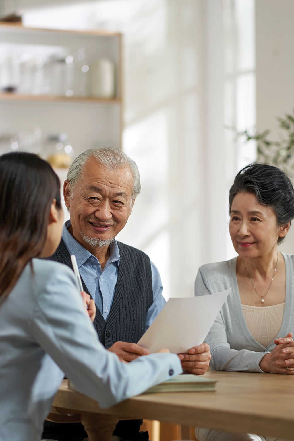 Older couple talking with advisor