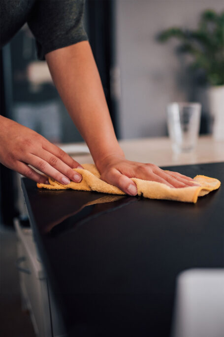 Woman cleaning counter