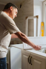 Man renovating bathroom