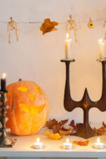 Antique halloween decor on mantel