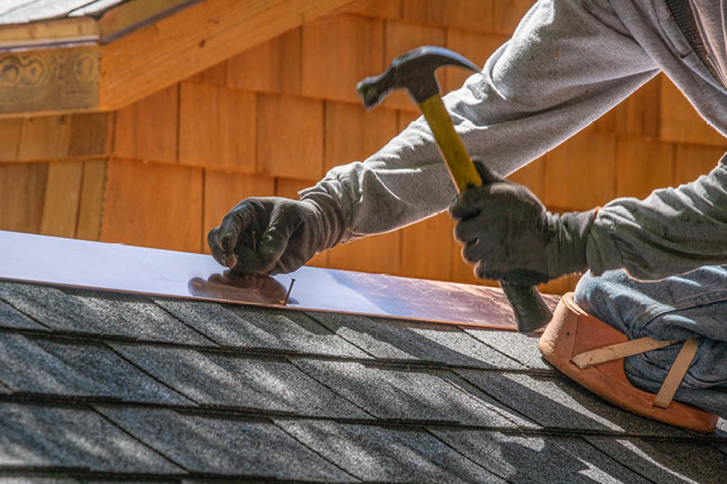 Man maintaining roof