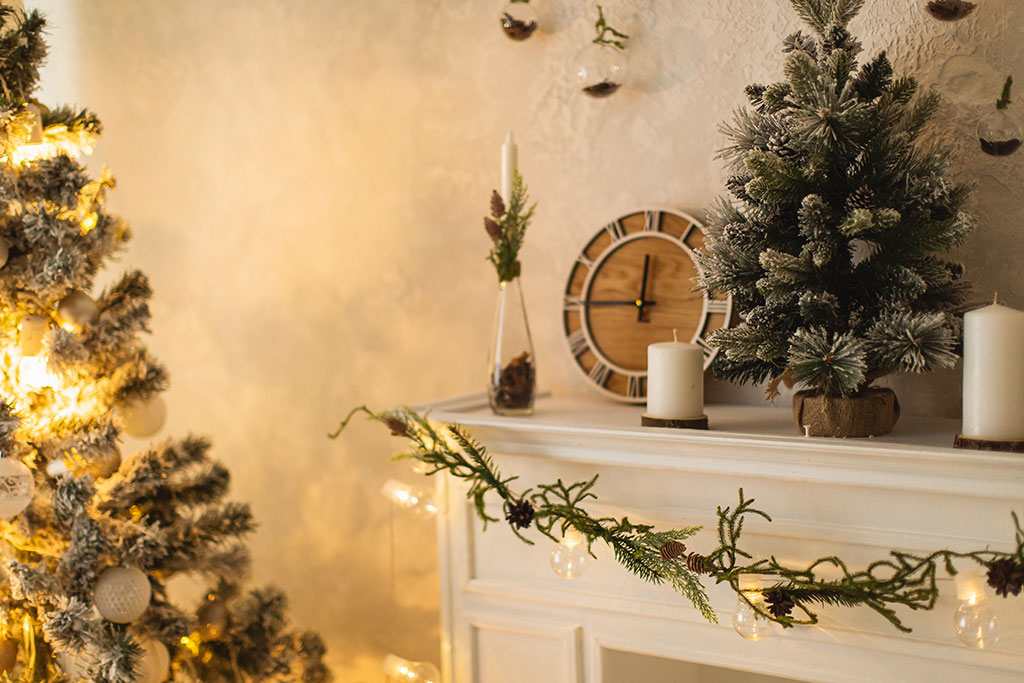 Fireplace mantel with pinecones and garland