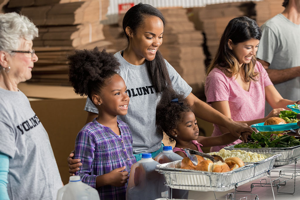 Mom and daughter volunteering