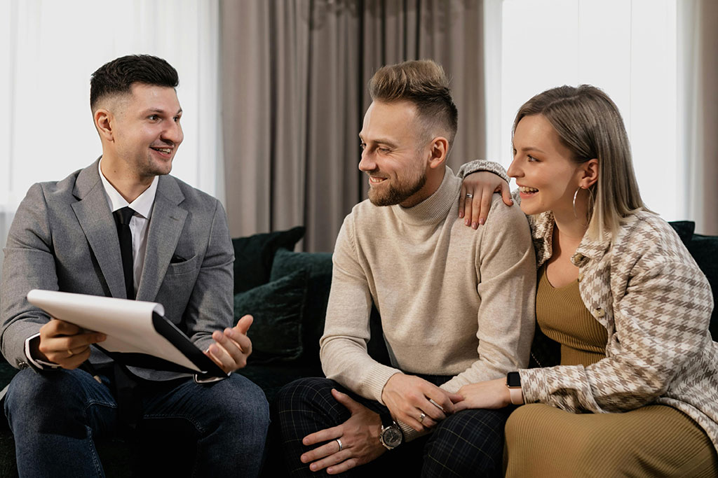 Couple talking to realtor