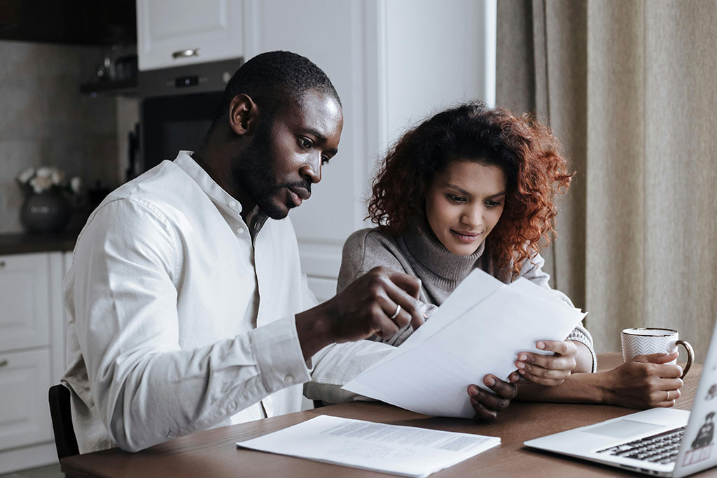 Couple looking over financial papers