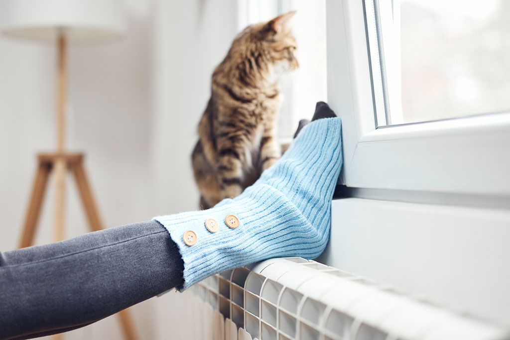 Woman with feet on window sill