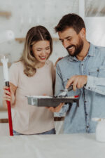 Couple repainting kitchen