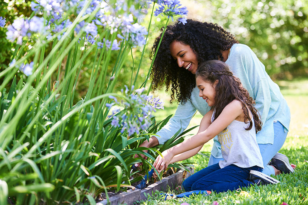 Mom and daughter gardening