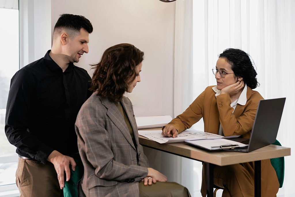 Couple talking with advisor