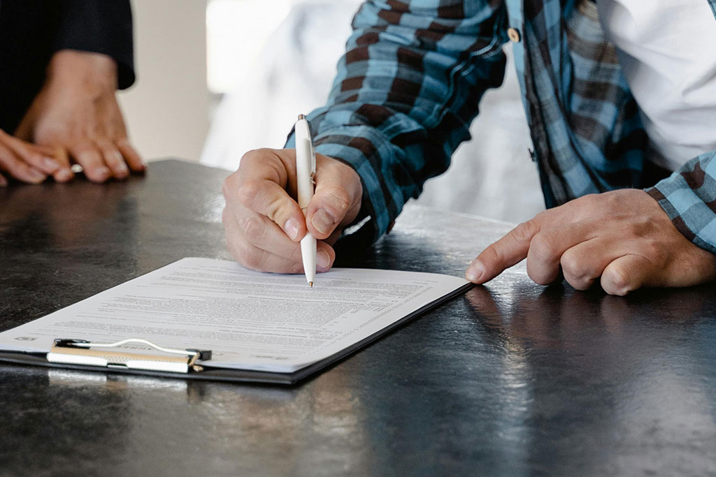 Man filling out paperwork