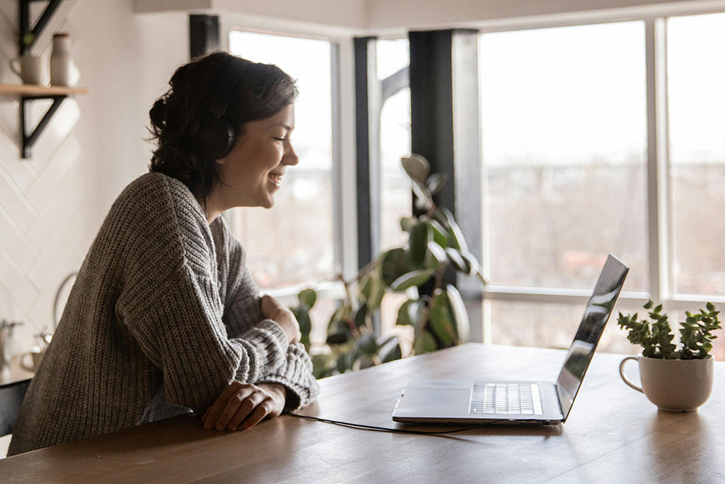 Woman looking at laptop