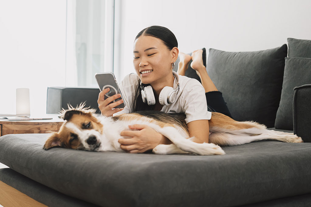 Woman on couch with dog