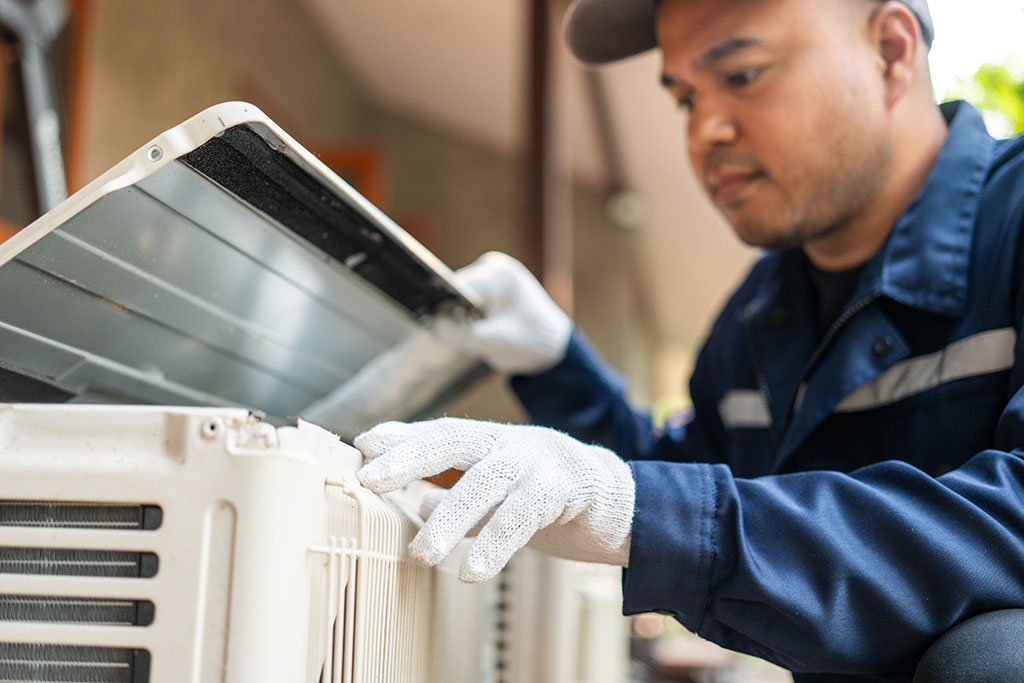 Man inspecting HVAC