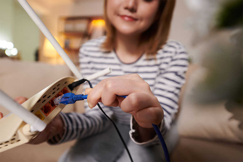 Woman connecting router