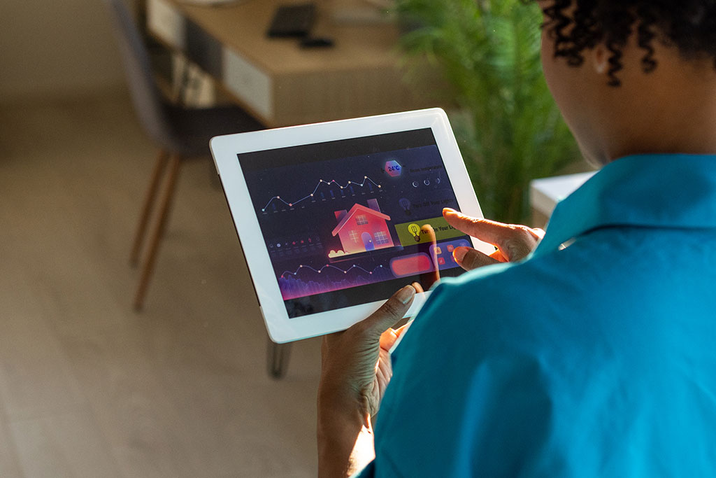Woman using tablet for smart home