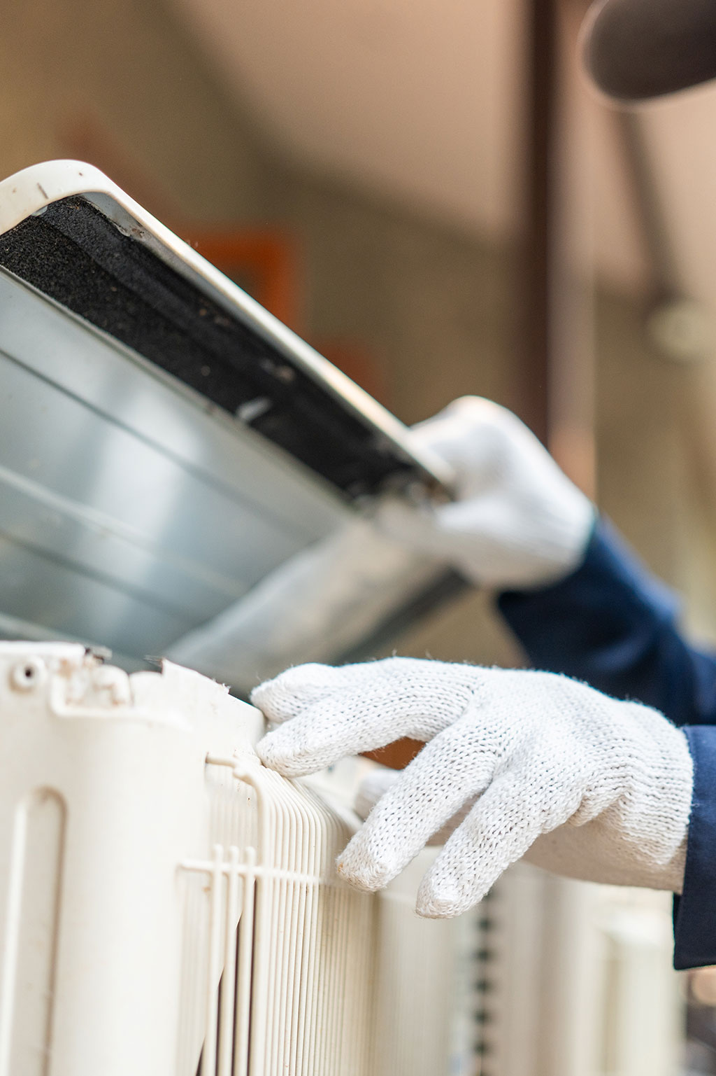 Maintenance person looking at HVAC