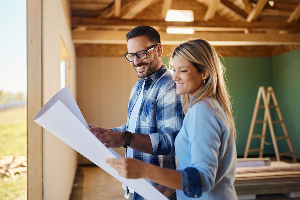 Couple looking at new construction in home
