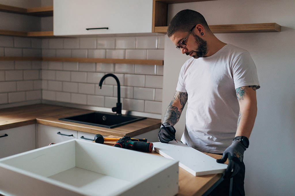 Man remodeling kitchen