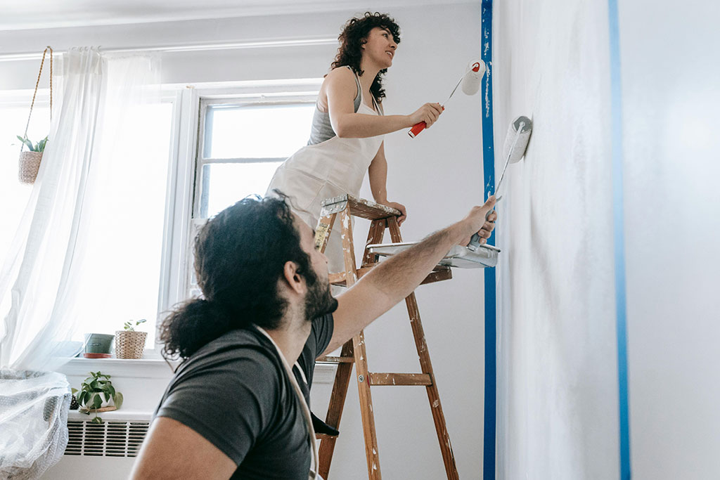 Couple painting walls
